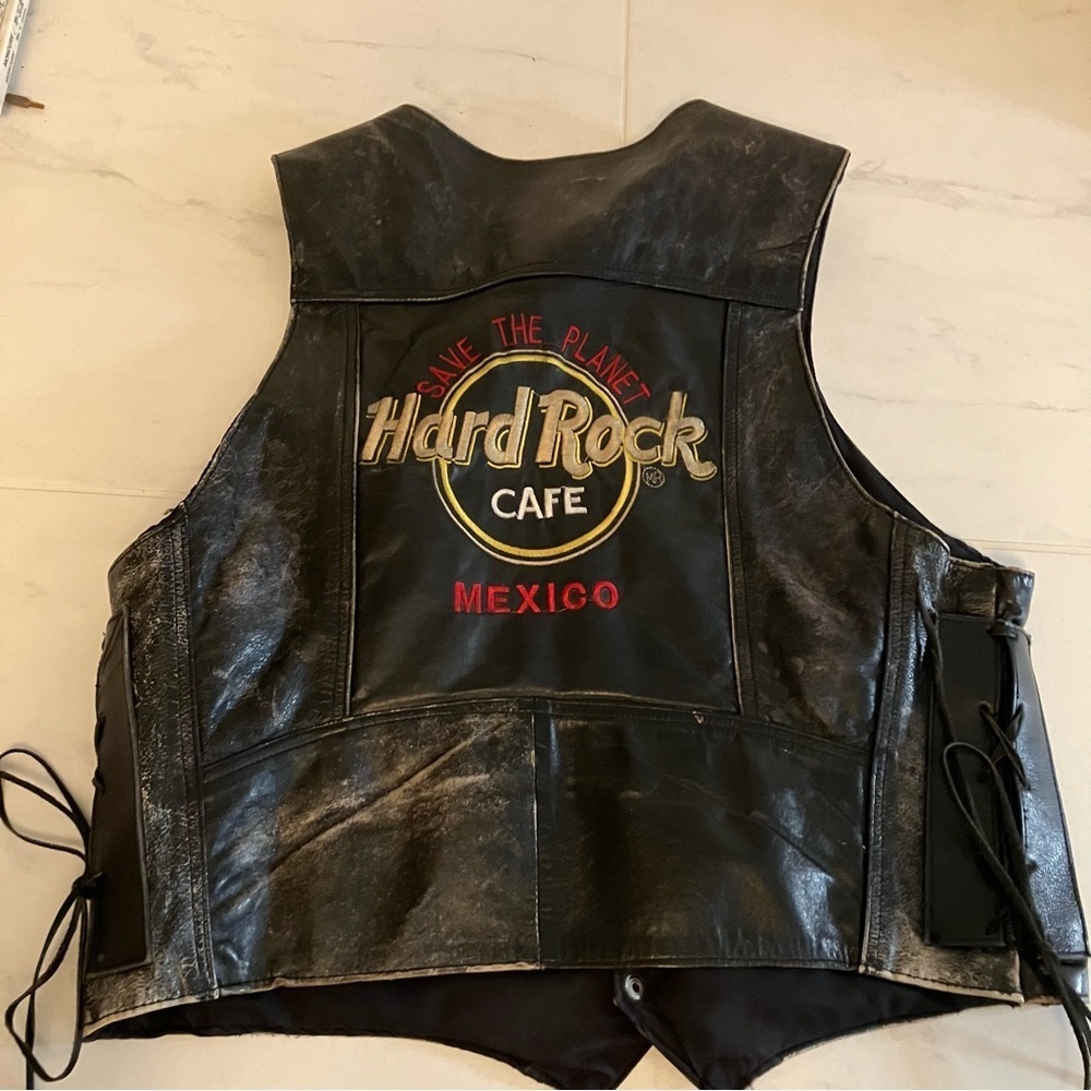 Hard Rock Cafe.  Harley Davidson.  Black pleather vest with ties at side.